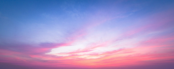 World environment day concept: Dramatic autumn sunset with twilight red and blue color sky and clouds background