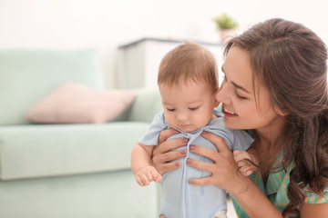 Poster - Loving mother with her baby at home