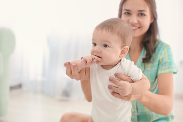 Poster - Loving mother with her baby at home