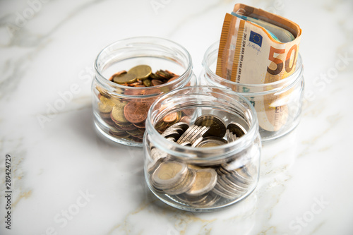 3 Glaser Konten Mit Euro Scheinen 2 Munzen Und Wechselgeld Zum Haushalten Und Sparen Buy This Stock Photo And Explore Similar Images At Adobe Stock Adobe Stock