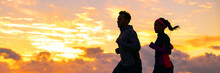 Run Fit Couple Sport Banner Panorama Of Runners Friends Woman And Man Training Cardio Together Running On Outdoor Race At Sunset Panoramic Background. Silhouettes Of Two Athletes Working Out.