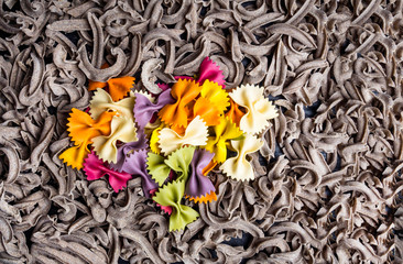 Wall Mural - italian food, farfalle colorful bows, and whole grain pasta