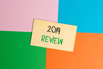 Text sign showing 2019 Review. Business photo text New trends and prospects in tourism or services for 2019 Office appliance colorful square desk study supplies empty paper sticker