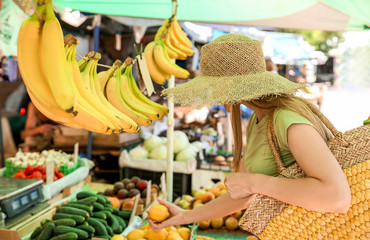 Woman choosing fruits at market