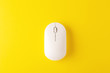 Wireless mouse on yellow background