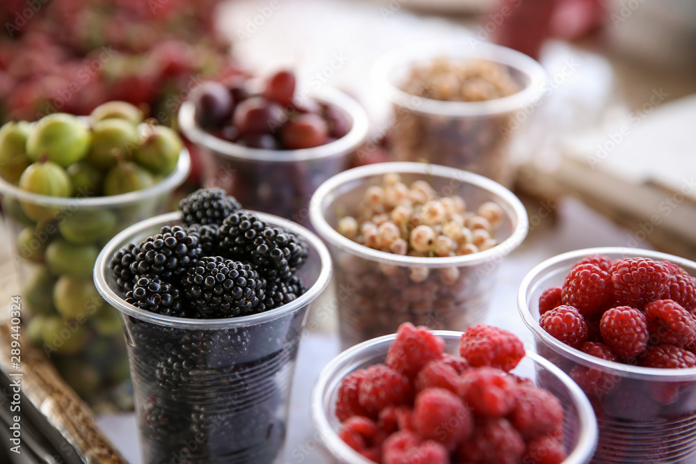 Assortment of fresh berries on counter at market