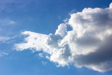 Simple beautiful gloomy blue sky with fluffy clouds in summer morning peace day as a background. Gray, white and turquoise color blurred skyline texture photography