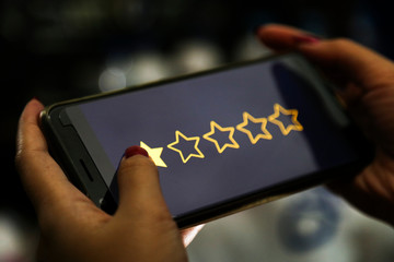 Sticker - hands showing profit graph on a smart phone