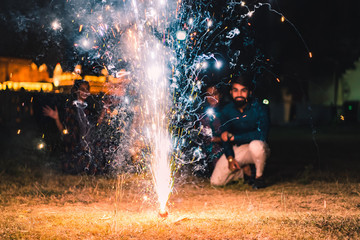 Wall Mural - People watching fireworks and celebrating Indian Festival Diwali. 