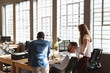 © Wavebreak Media - Young creative professionals working in a sunlit office