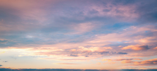 Wall Mural - Dramatic sun ray with orange sky and clouds dawn texture background