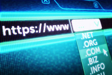 Internet Communication And Global Computer Network Hosting Concept, Close-up View Of A Computer Screen With A Web Browser With Text "http Www" And A Frame With Domain Names
