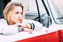 Beautiful Blonde Woman With Blue Eyes Looking At The Orizont - Adult With Great Red And White Van - Lifestyle Concept