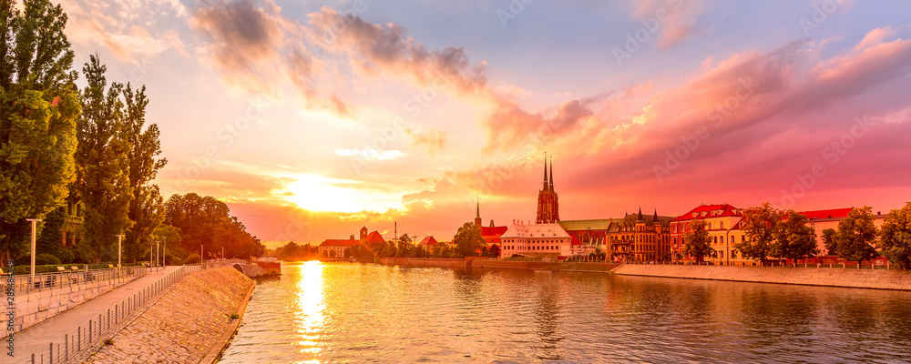 Obraz na płótnie Wroclaw, Poland sunset panoramic banner with Ostrow Tumski island, Odra or Oder river and cathedral towers w salonie