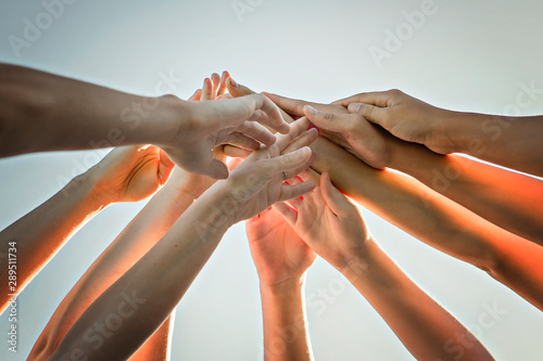 Cuadros en Lienzo many hands over a nice sky, team work