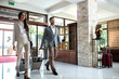 © didesign - Sexy business couple entering the lobby