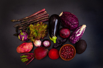 Poster - Heap of raw purple vegetables on the black