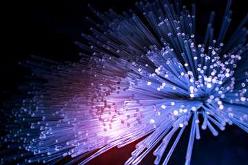 fiber optics network cable for ultra fast internet communications, thin light threads that move information at high speed.