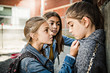 Leinwandbild Motiv A sad girl intimidation moment on the elementary Age Bullying in Schoolyard