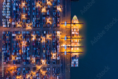 Fotografía Aerial top view of container cargo ship in the export and import business and logistics international goods in urban city