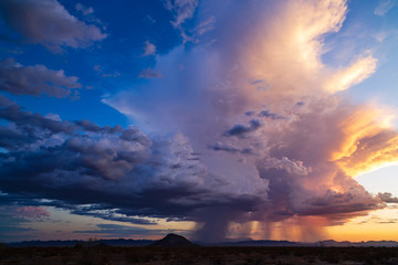 Wall Mural - dramatic sky with storm clouds at sunset