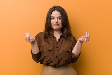 Wall Mural - Young curvy russian woman showing that he has no money.