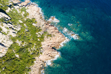 Wall Mural - View from above, stunning aerial view of a green rocky coast bathed by a beautiful turquoise sea. Costa Smeralda (Emerald Coast) Sardinia, Italy.