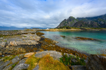 Sticker - Viewpoint close to Henningsvaer, mountains, sea and rocks during the cloudy season in summer at the Lofoten Islands in Henningsvær, northern Norway