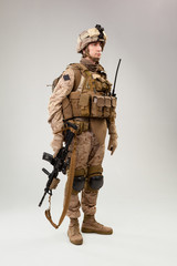 United states Marine Corps special operations command  raider with weapon. Studio shot