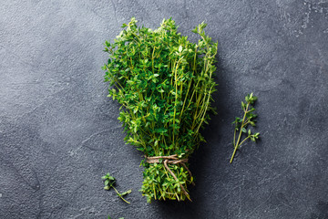 Fresh thyme bunch on slate background. Top view. Copy space.