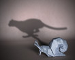 Concept of hidden potential. A paper figure of a snail that fills the shadow of a cheetah. 3D illustration