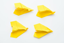 Bad Experience And Failure. Four Yellow Wrinkled Paper Airplanes Isolated On White Background. Copy Space.