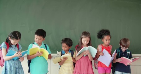 Wall Mural - Multi-ethnic group of school children studying in classroom