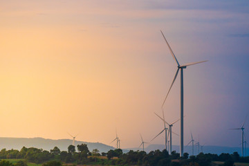 Wall Mural - Green energy concept, eco power. Wind turbine Located along the hill With the wind blowing all the time. Can produce renewable energy as well. Considered a clean energy.