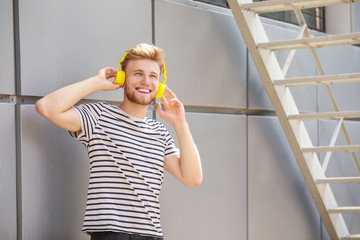 Sticker - Handsome young man listening to music outdoors