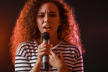 Sticker - Beautiful African-American female singer with microphone on stage