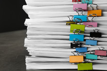 Stack Of Documents With Binder Clips On Grey Stone Table, Closeup View