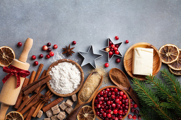 Wall Mural - christmas cookies and spices on wooden background