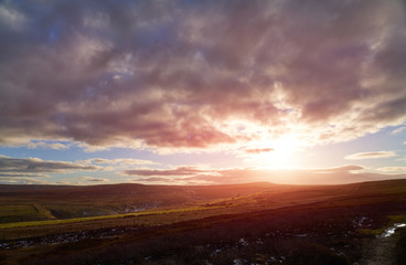 Wall Mural - strong red and orange sunset over the summit of bolts law near edmundbyers in county durham.