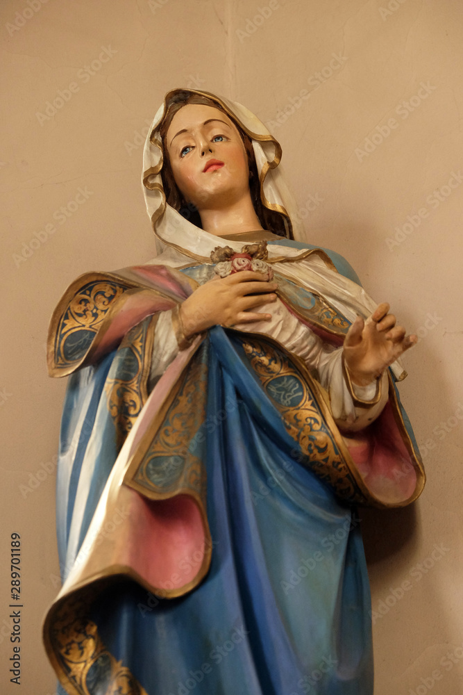 Immaculate Heart of Mary, statue on the altar in the church of Saint Martin in Zagreb, Croatia - obrazy, fototapety, plakaty 