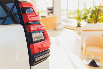 Wall Mural - Car detail. New led taillight by night. The rear lights of the car, in hybrid sports car. Developed Car's rear brake light.