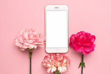Mobile Phone With Pink Carnation Flower On Pink Background