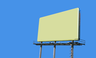 Wall Mural - Huge billboard with yellow background under blue sky. Copy space.
