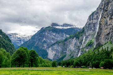 Wall Mural - Cloudy Lauterbrunnen valley in Switzerland's Alps