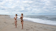 © Dmytro Flisak - Young women practicing yoga on the beach