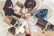 © InfiniteFlow - Businessmen and businesswomen joining hands in group meeting at multicultural office room showing teamwork, support and unity in business. Diversity workplace and corporate people working concept.