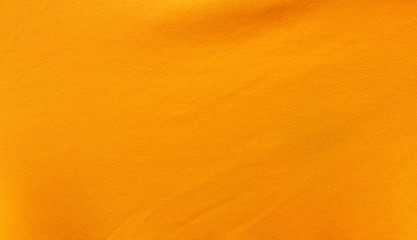 Texture of crease on orange fabric