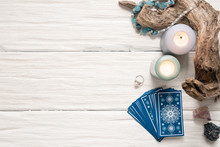 Blue Tarot Cards On White Wooden Table Background.