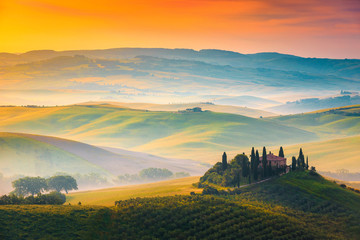 Wall Mural - Beautiful foggy morning landscape at sunrise, Tuscany, Italy