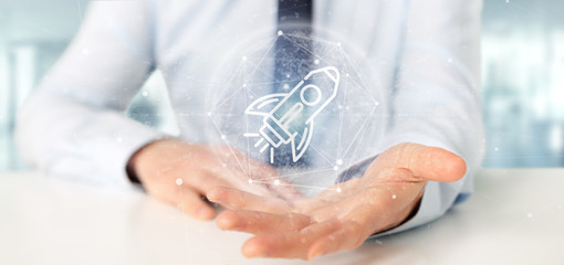 Poster - businessman holding a start up rocket on a sphere 3d rendering